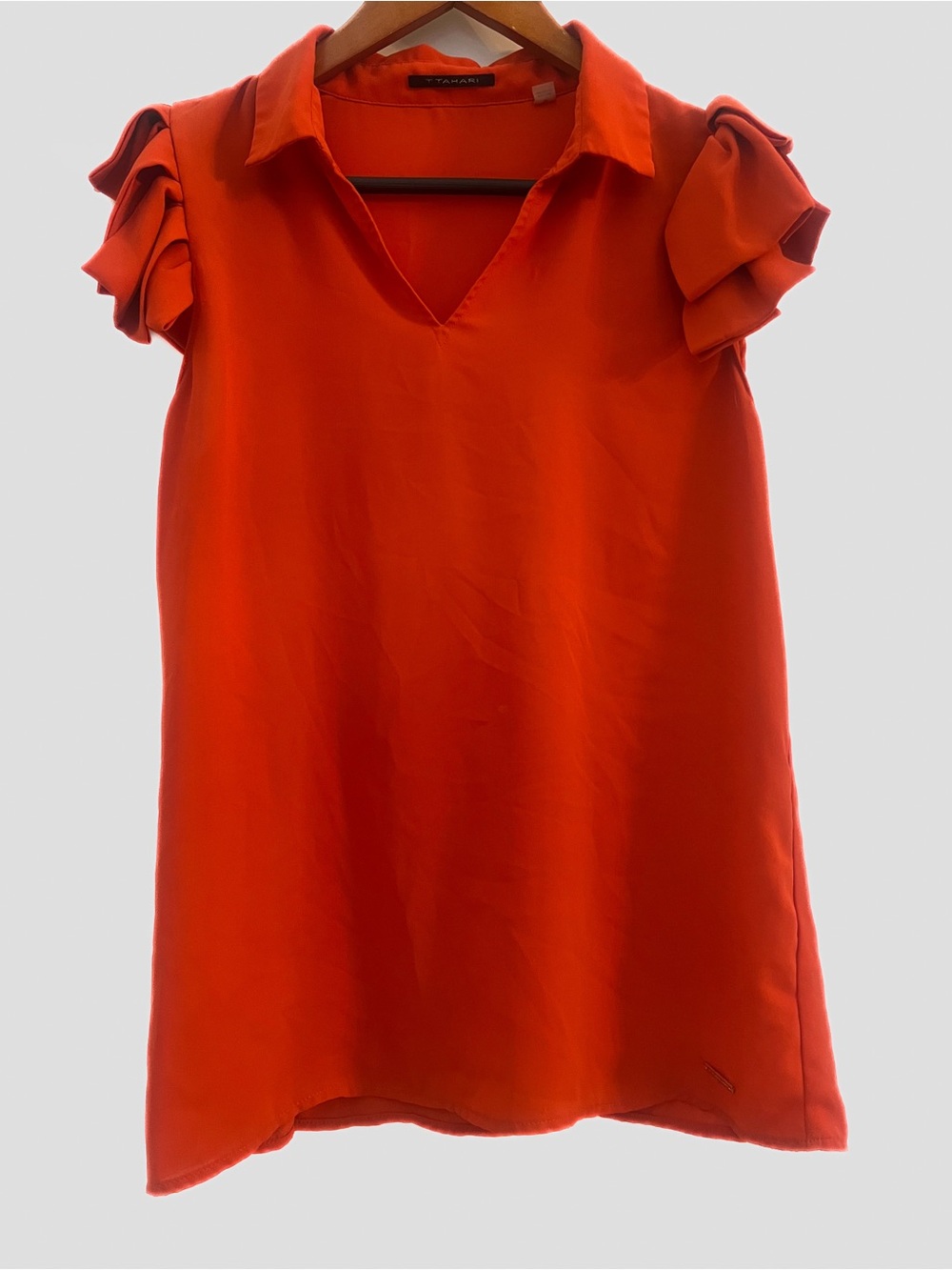 Unique T Tahari vibrant orange top. Size medium